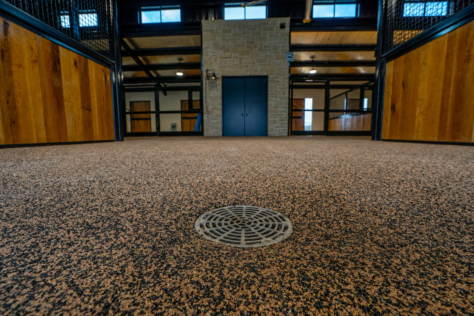 Barn interior with rubber floor and drain