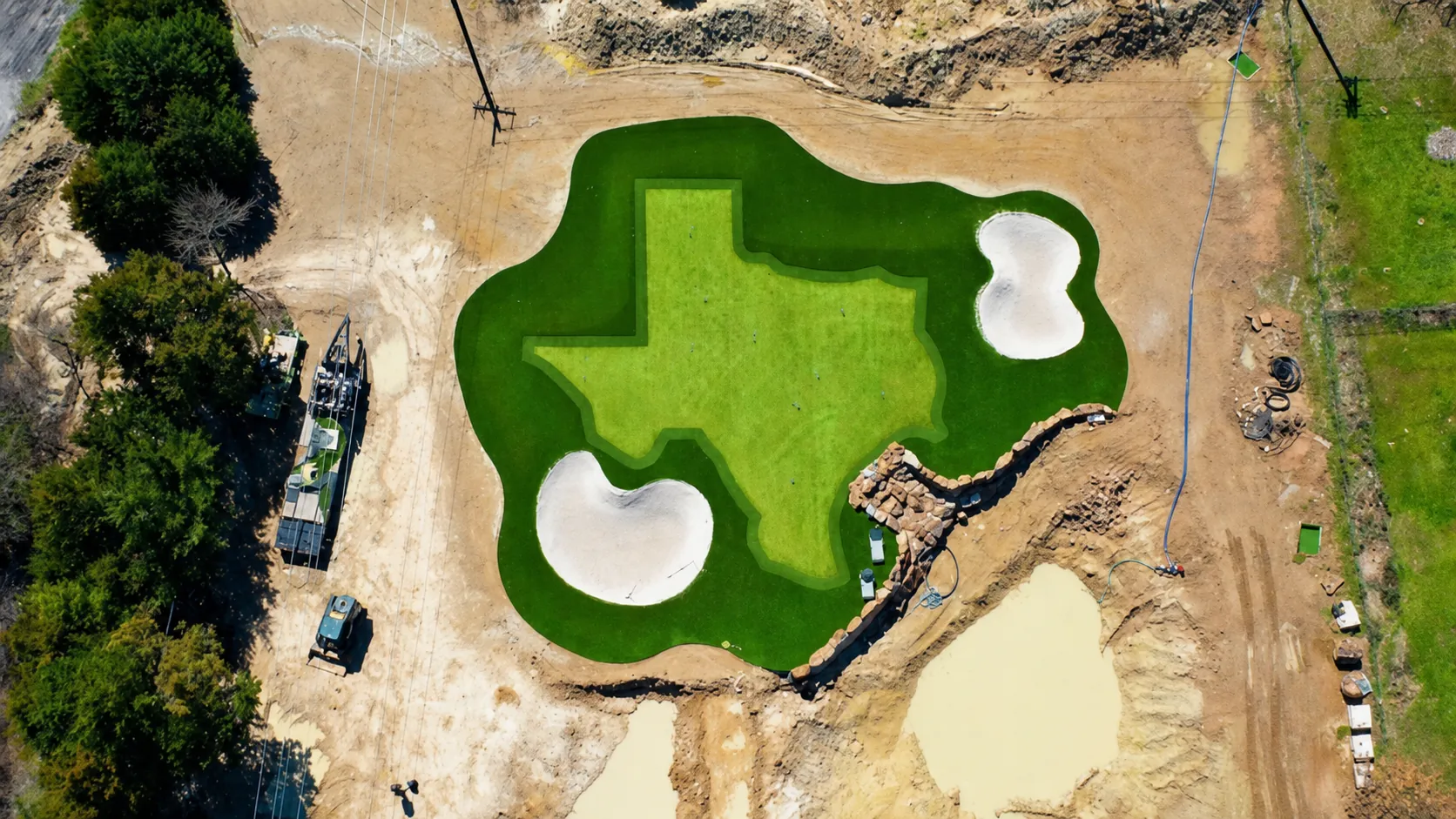 Texas-shaped putting green with sand traps