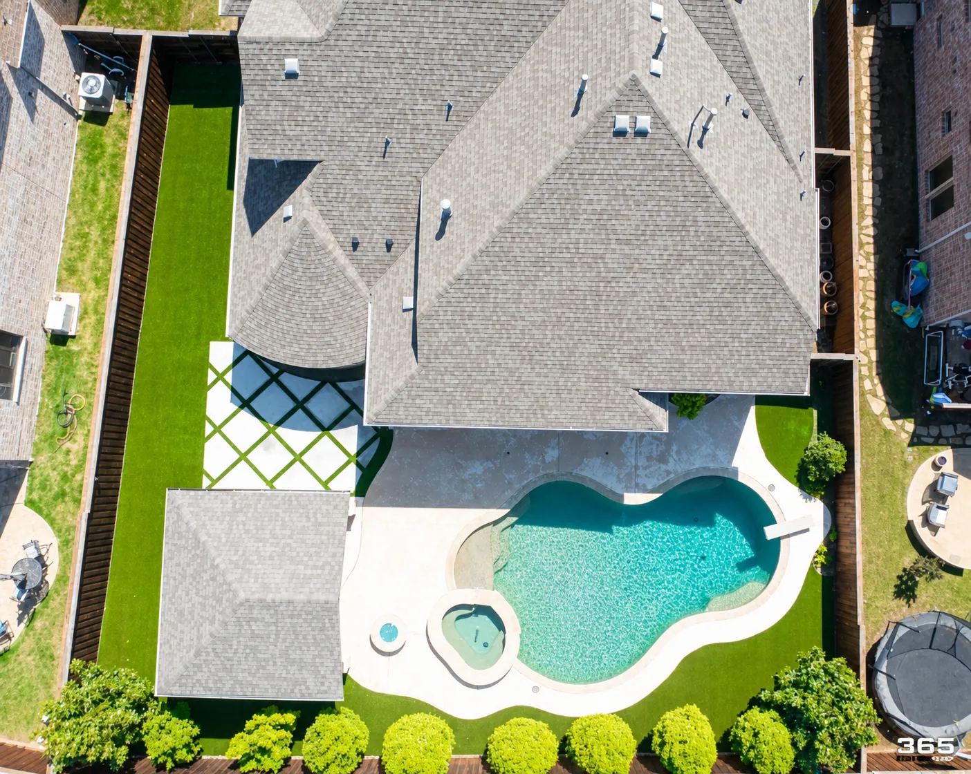 Aerial view of home with pool and turf