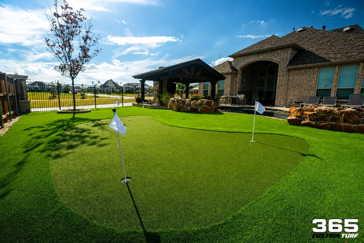 Putting green with pavilion and blue sky