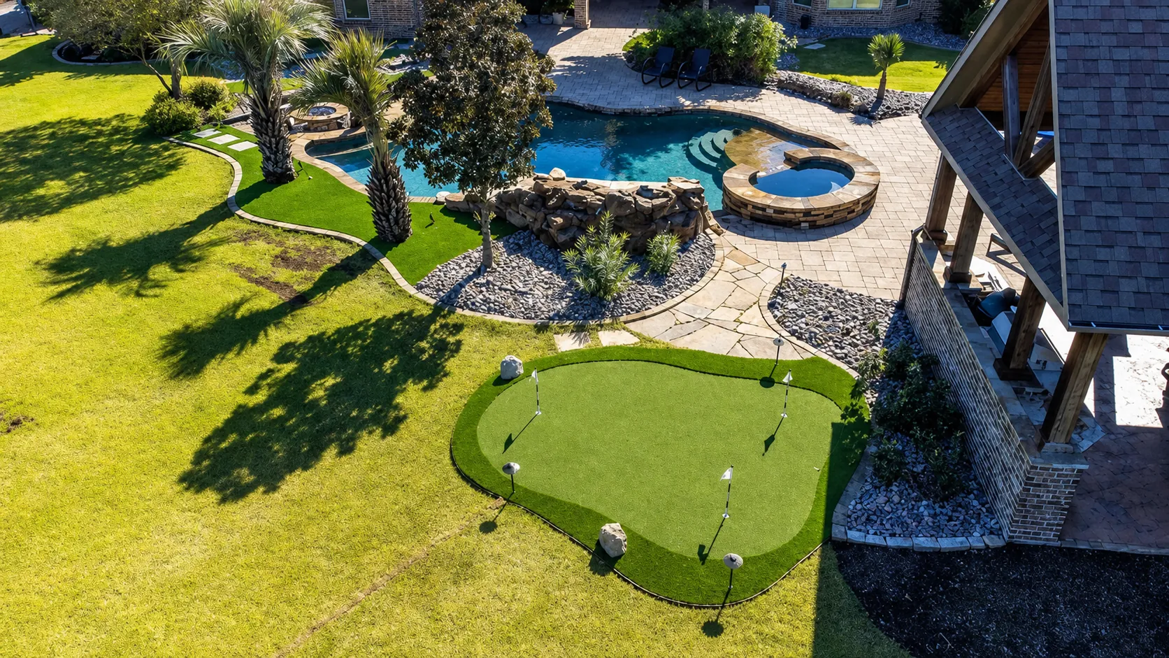 Aerial putting green with pool and hot tub