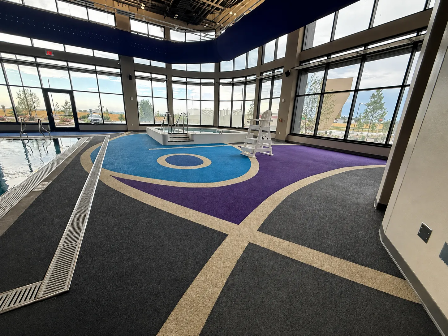 Indoor aquatic center with decorative rubber surfacing